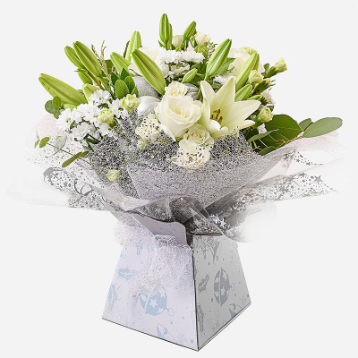 Ava - A creamy selection of blossoming buds in shades of white, complimented by greenery and carefully hand-tied. Beautifully presented, only the perkiest petals make up this creation. Include a message for that personal touch.
