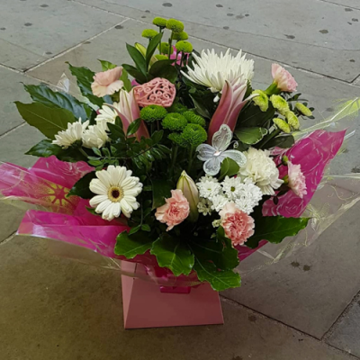 Fairytale Feeling - A gorgeous handtied in water presented in a gift box/bag. Created using white and pink flowers with complimentary foliage. Hand delivered with care by the Flower Studio Rochdale.